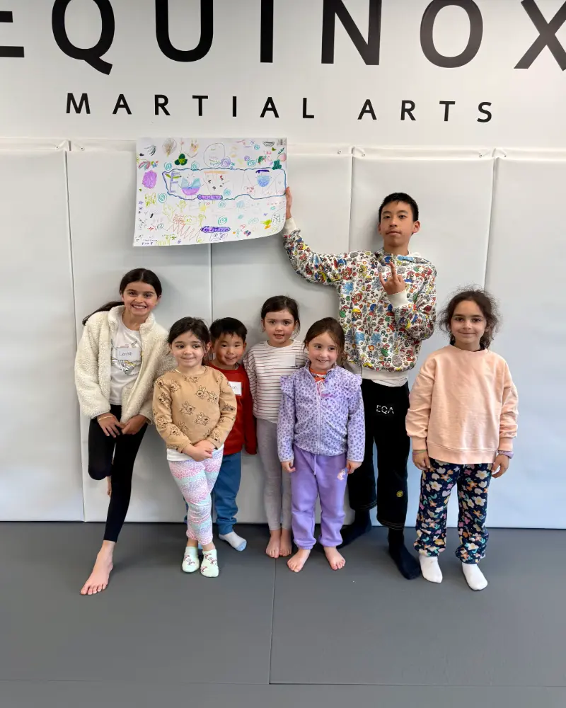 Kids sharing the arts and crafts that they have worked on at Equinox's holiday camps