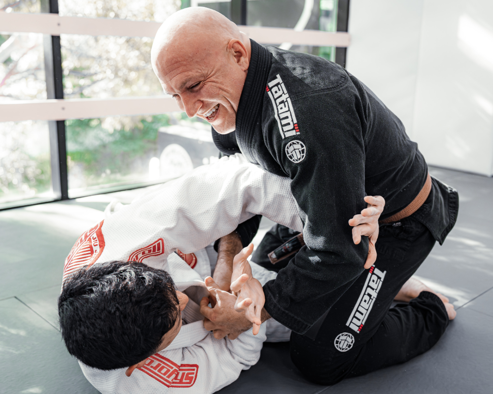Equinox Academy's BJJ students practising the half guard position